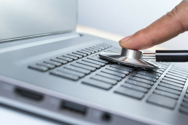 technician checking the health of laptop computer