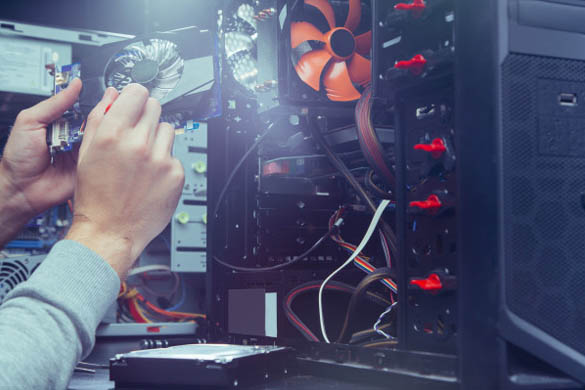 Technician building a custom desktop computer