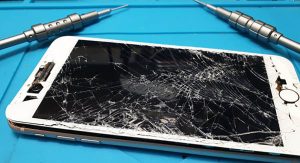 iPhone 8+ with cracked screen being repaired